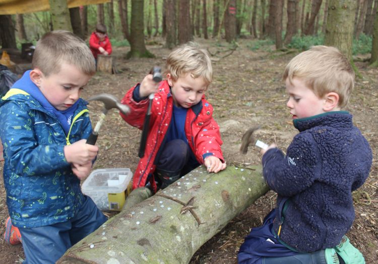 Forest School, 10 years, outdoor learning, tool work, hammering, independent learning 