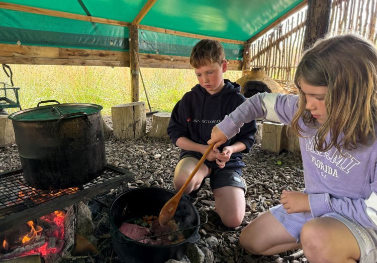 cooking lunch over a fire