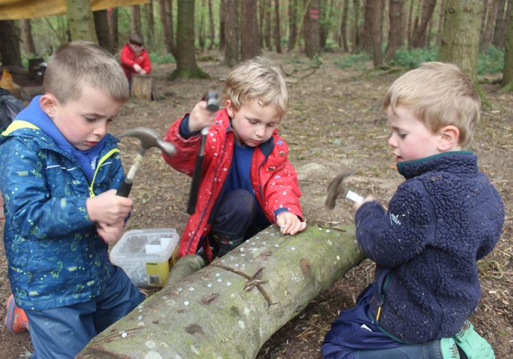 Forest School, 10 years, outdoor learning, tool work, hammering, independent learning 