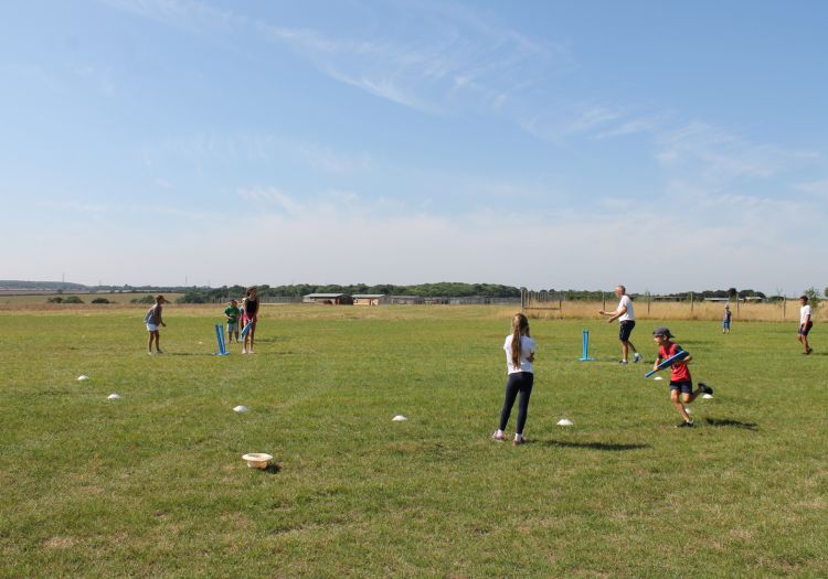 playing cricket with a sports coach