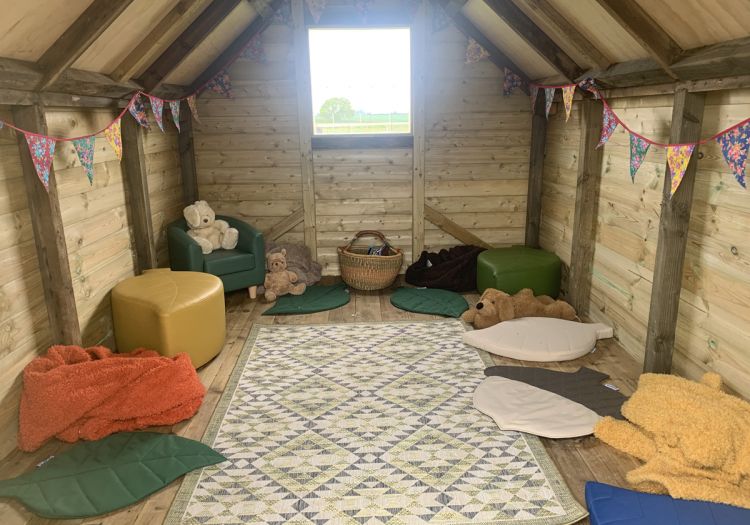 Inside our Shepherd's hut reading den