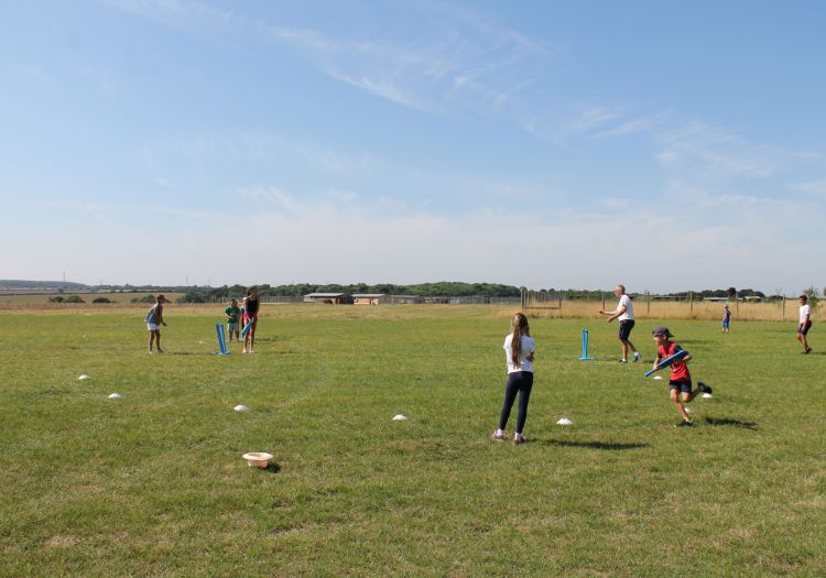 playing cricket with a sports coach